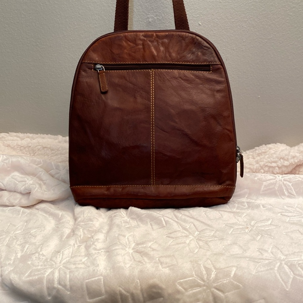 Jack Georges brown leather small backpack.